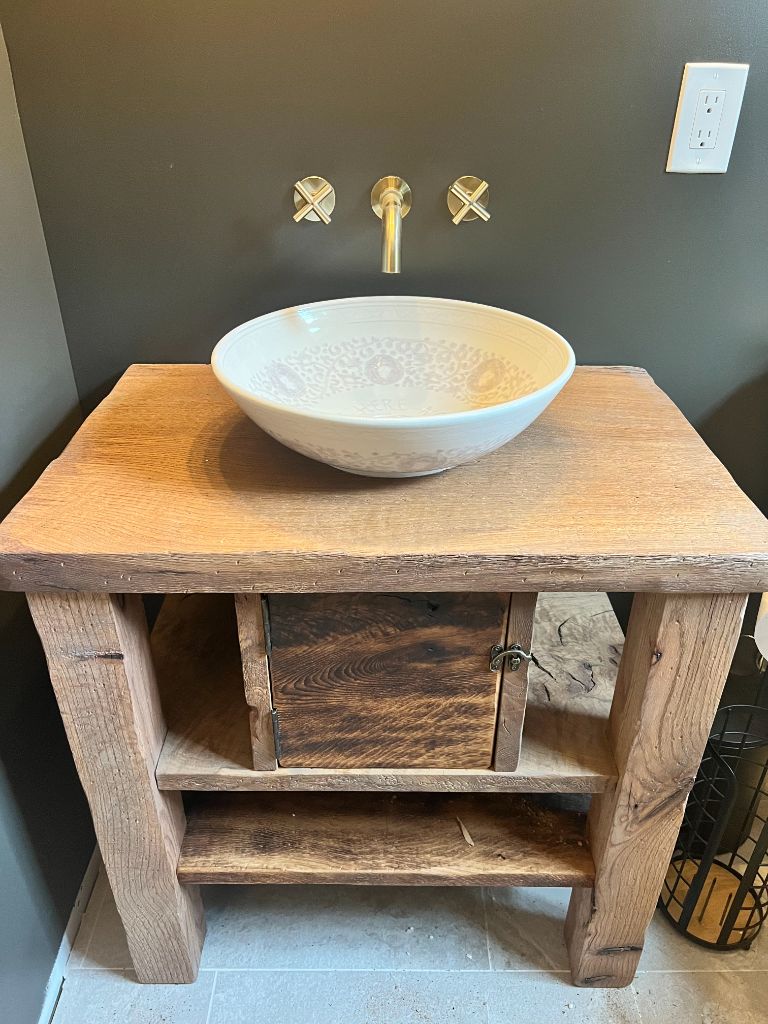 Rustic wood vanity with ceramic vessel sink