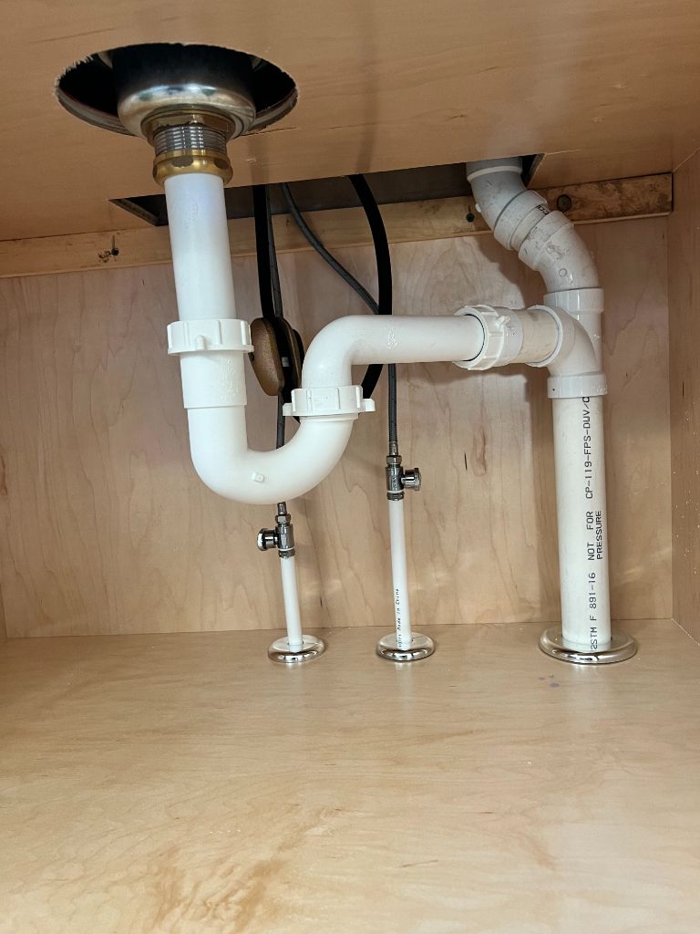 Under-sink drain trap and supply line installation