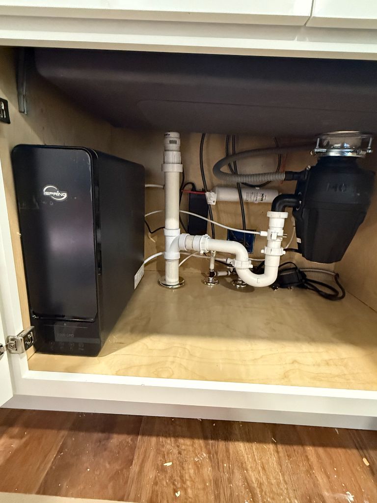 Under-sink water filtration system and garbage disposal