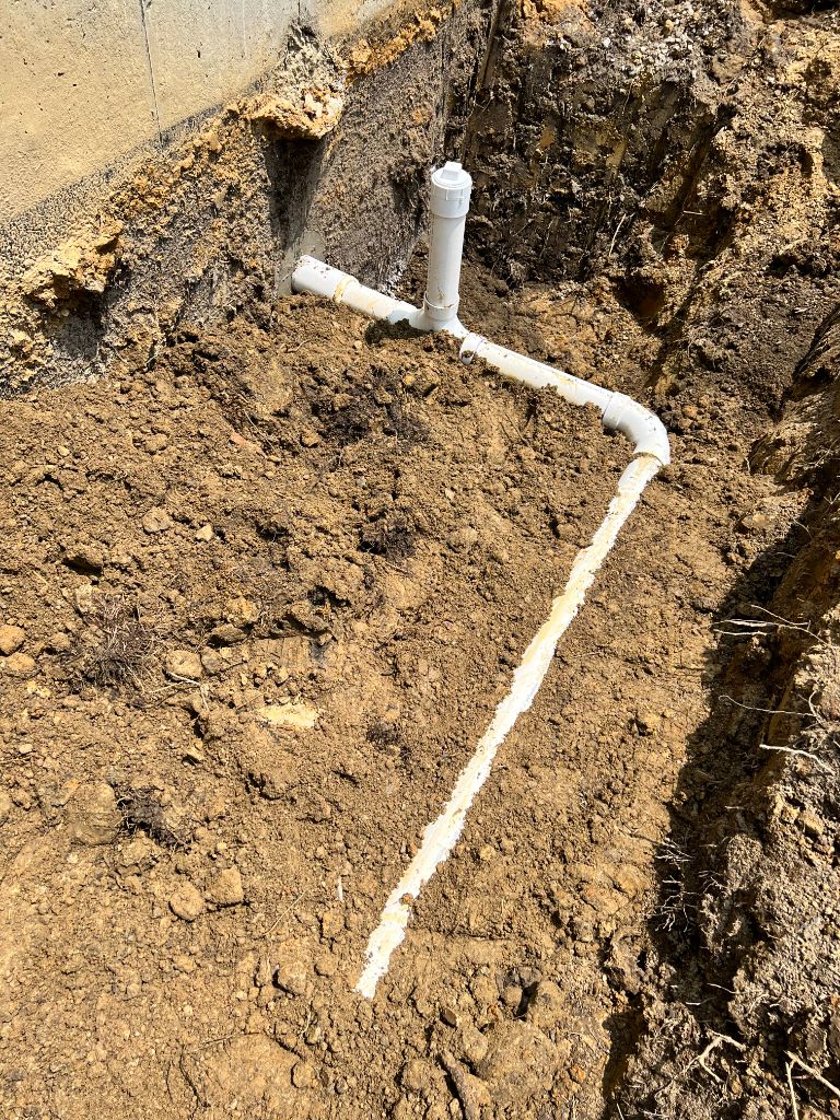 Sewer pipe repair at foundation wall