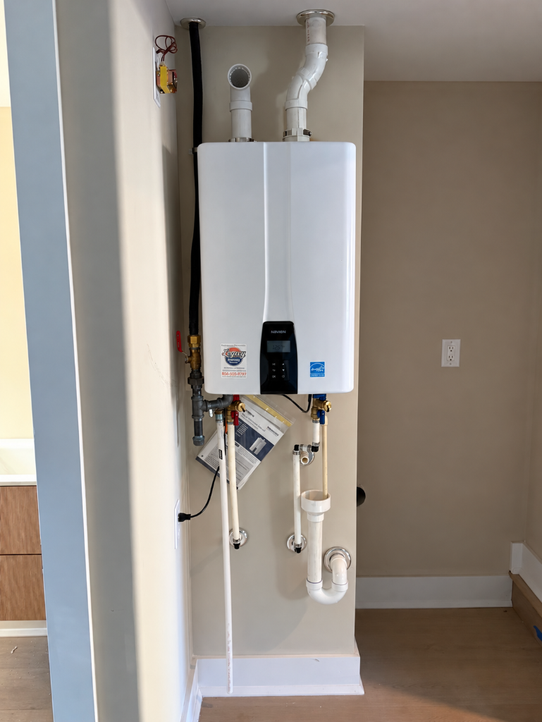 Navien tankless water heater installed on a wall by Legacy Plumbing South Jersey
