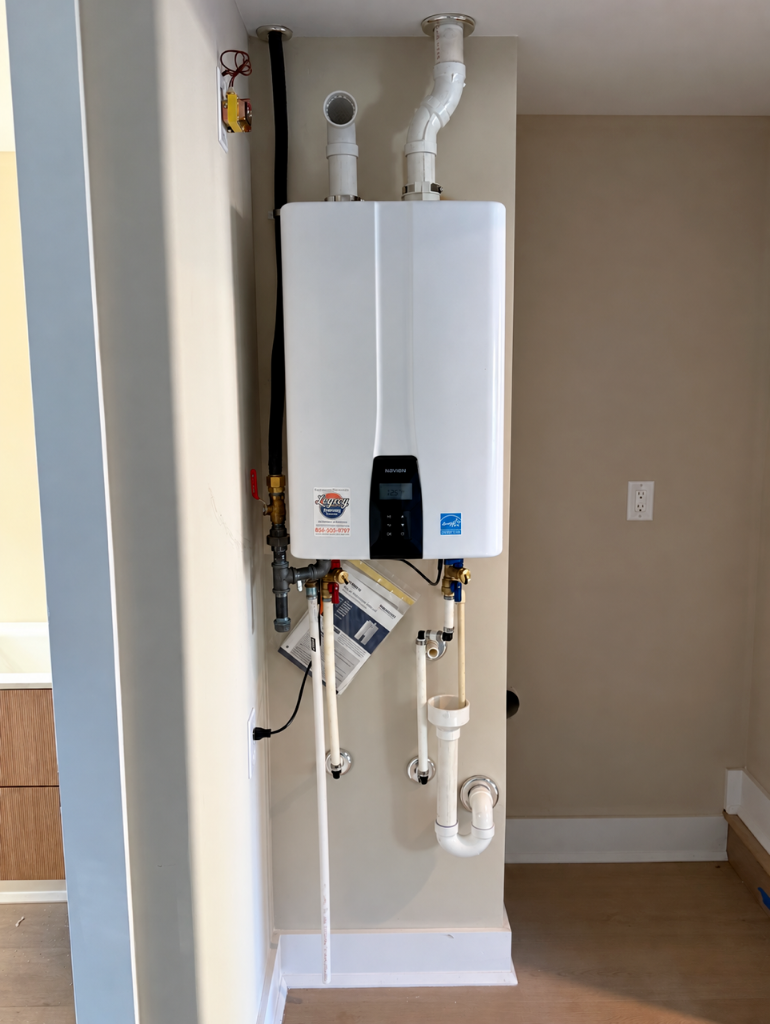 Navien tankless water heater installed on a wall by Legacy Plumbing South Jersey
